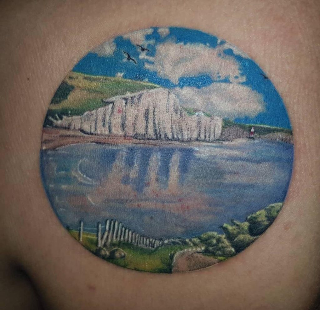 image of a shoulder tattoo depicting beachy head, East Sussex