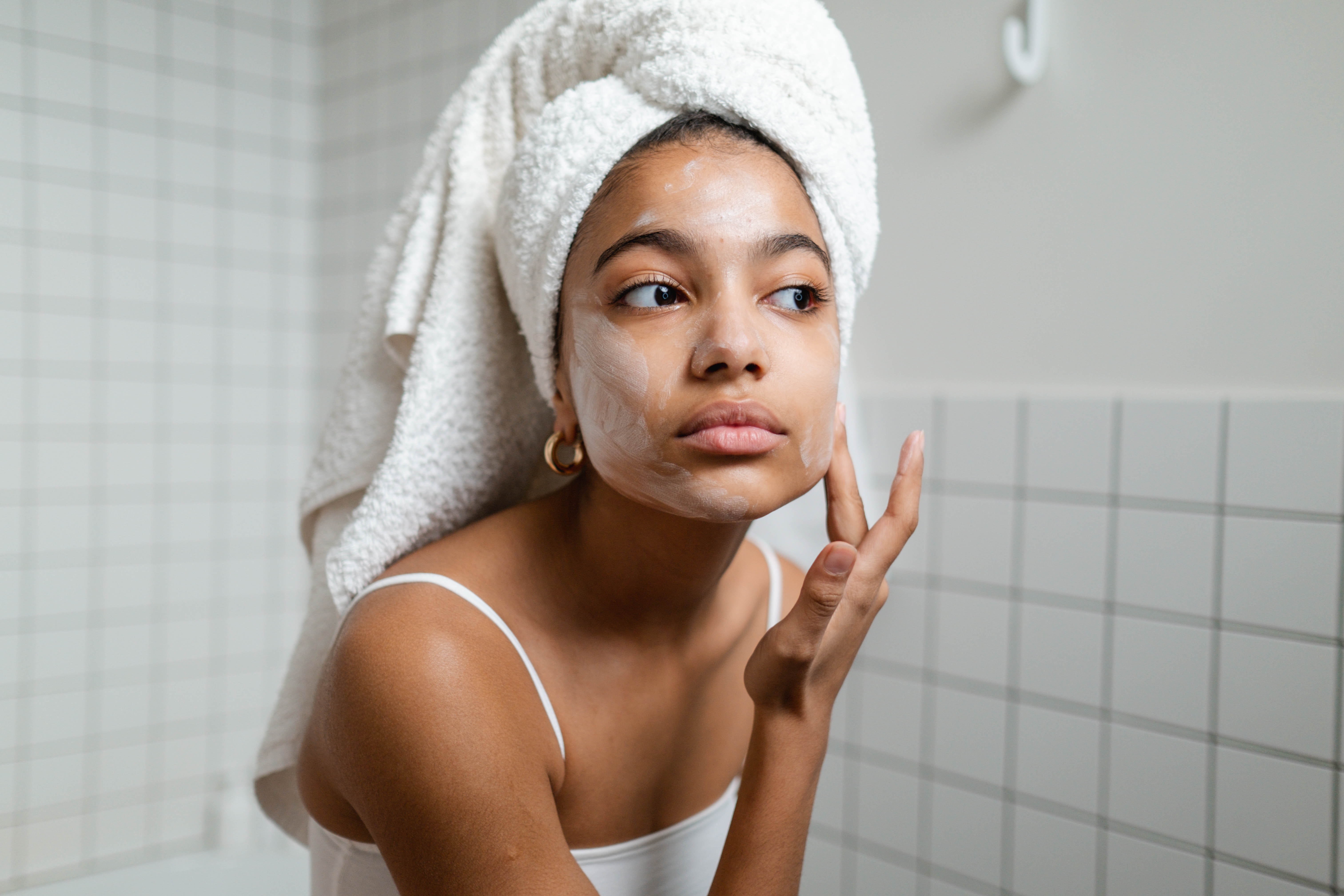 image of someone in a bathroom doing skincare