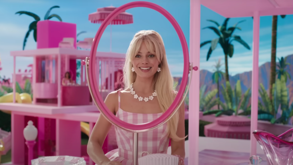 screengrab from the Barbie 2023 trailer, depicting Barbie (Margot Robbie) looking in a mirror