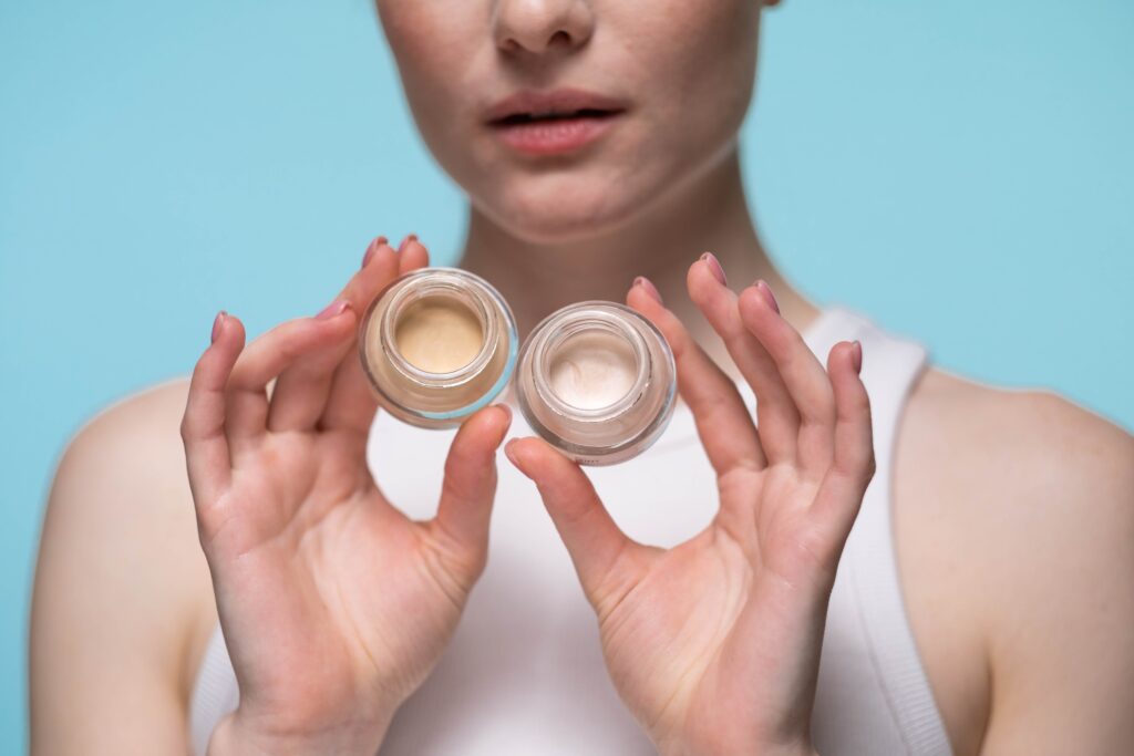 person holding different concealer shades